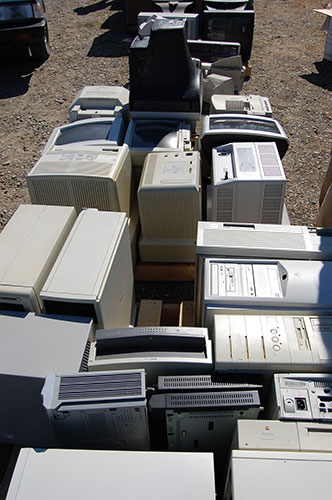 a bunch of old computers in a junkyard